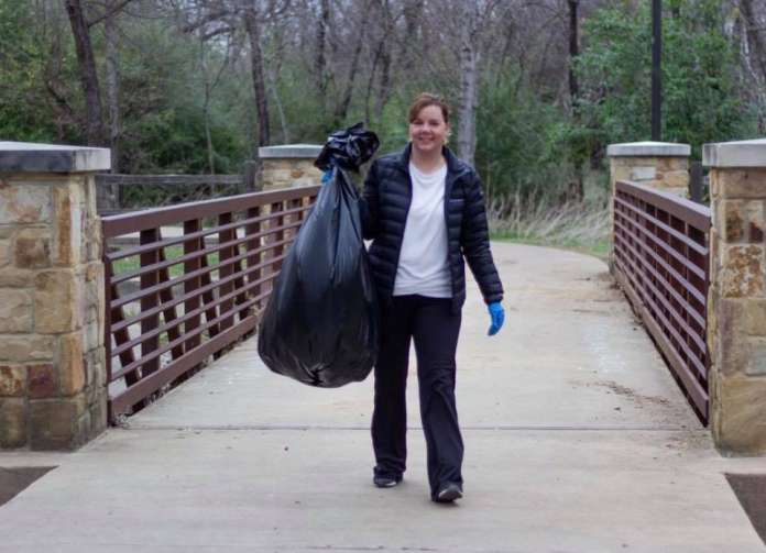 Council Member Roxanne Thalman joining the cleanup effort.